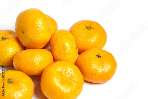 Heap tangerine or mandarin citrus fruit isolated on white background