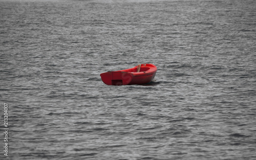 red boat on a grey sea