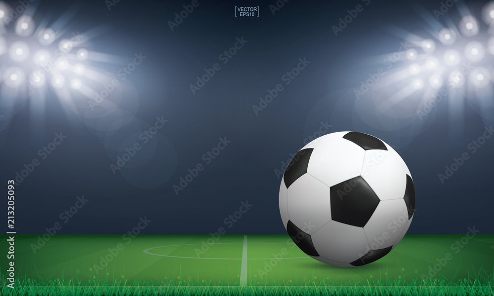 Naklejka premium Soccer football ball on green grass of soccer field or football field stadium background. Vector.