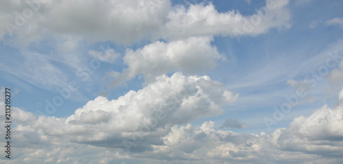 white clouds in the blue sky. fluffy clouds. background.