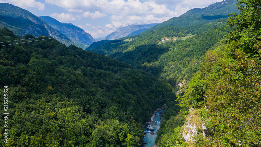 View on Tara river canyon in a cloudy day, mountains around, Montenegro, Dzurdzevica Bridge