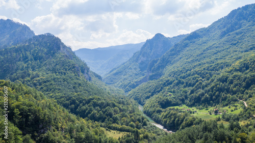 View on Tara river canyon in a cloudy day, mountains around, Montenegro © Maria Shaytor