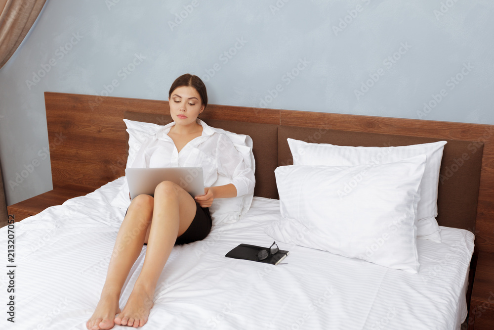 Woman working in hotel room