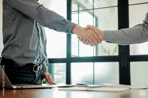 Business confident handshake and business people after discussing , success concept