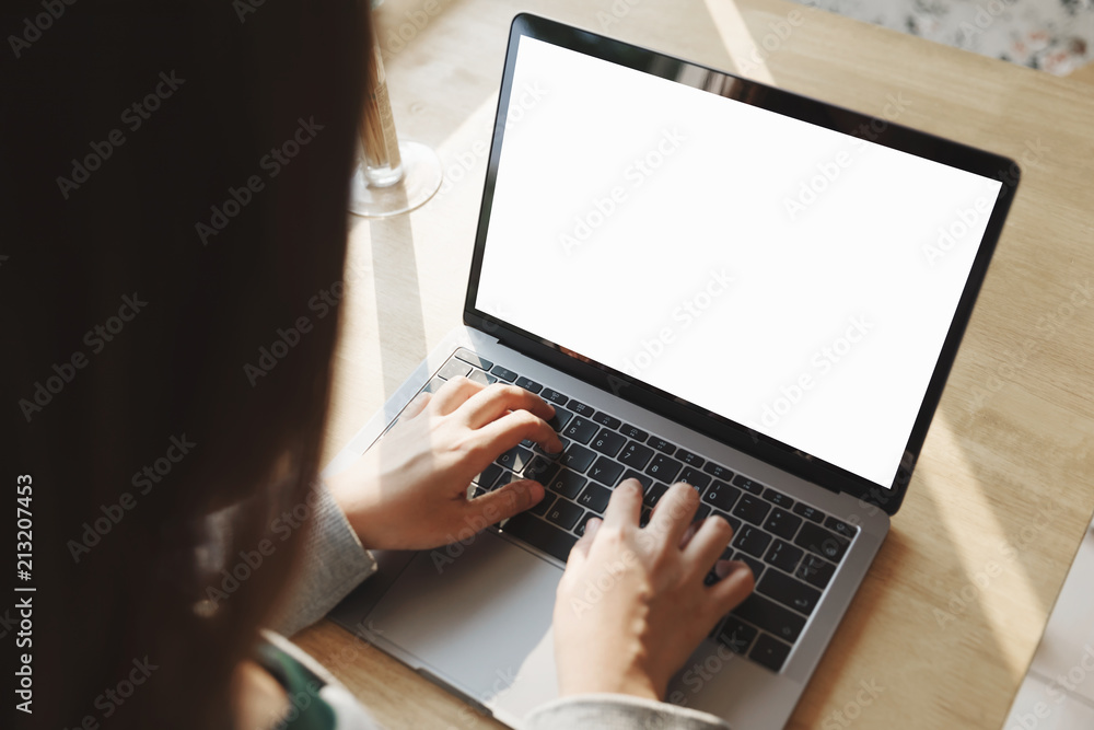Man using laptop with blank screen at table in the office. Man using laptop with blank screen at table in the office.