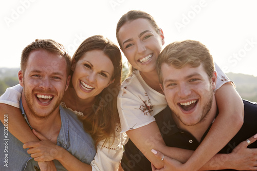 Portrait Of Young Couples Having Fun On Holiday Together