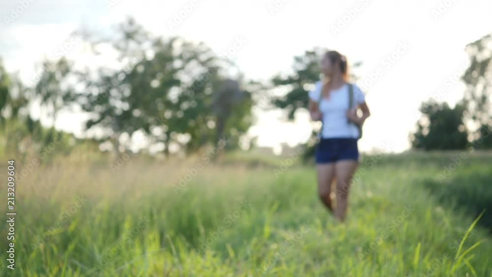 Hiking woman trekking with backpack walking travel in forest Hiking woman trekking with backpack walking travel in forest