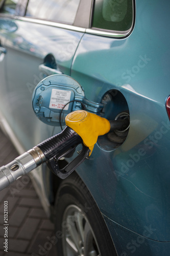 refueling the fuel tank of the machine with diesel or gasoline at a filling station