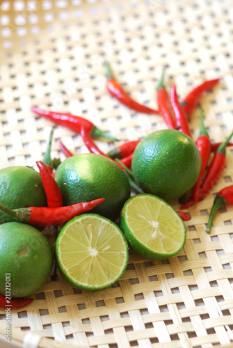 Red chili peppers and limes. photo