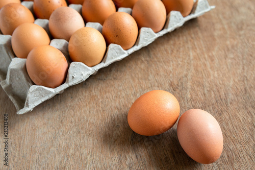 Fresh chicken eggs eggs in paper tray,egg carton on wooden background.