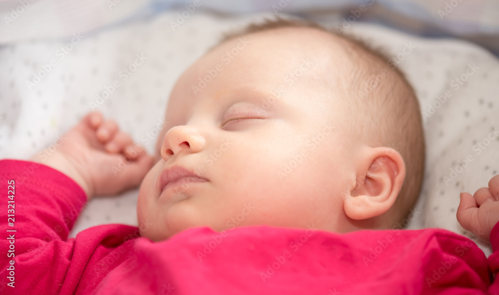 Portrait of baby sleeping in a crib, close up Portrait of baby sleeping in a crib, close up