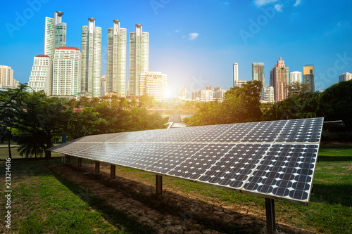 Photography Solar panel with modern urban construction and skyscrapers background