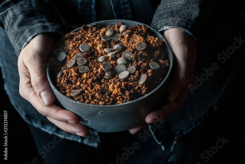 Man eating crunchy quinoa granola photo