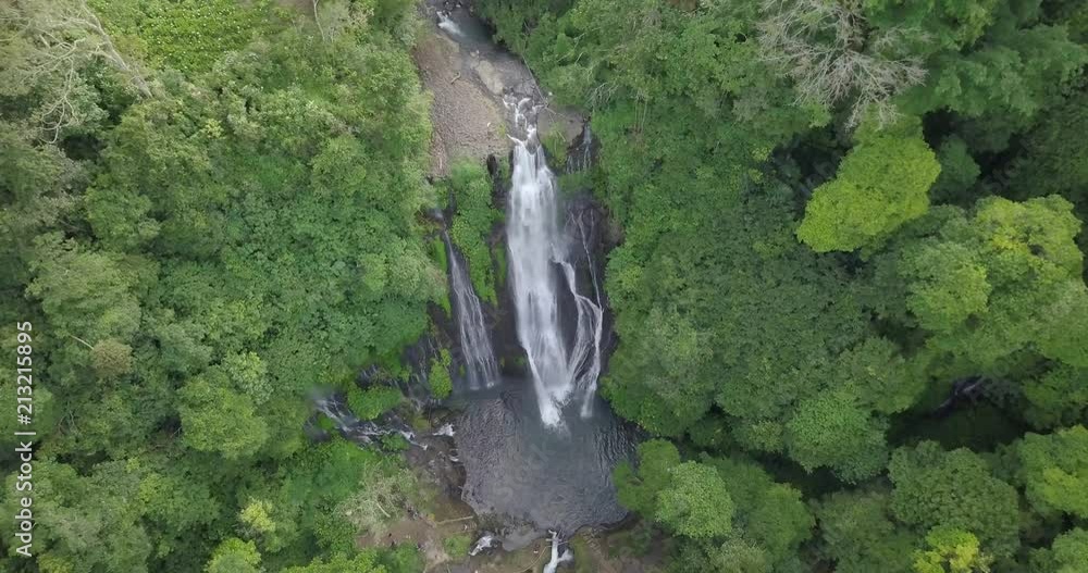Aerial view coming down into waterfall in Bali, Indonesia. Aerial view coming down into waterfall in Bali, Indonesia.