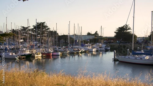 Marina Close Up of Boats Sitting Parked at the Docs at Sunset, quiet and calm photo