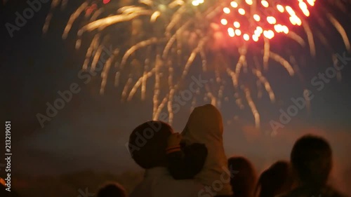Unrecognizable family fireworks. People are watching fireworks 4k
