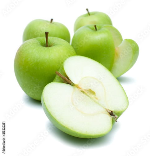 Green golden delicious apples over white