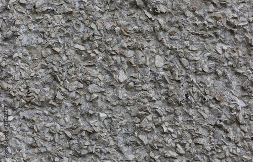 rough unpolished concrete surface with stones abstract pattern texture background horizontal