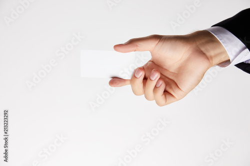 cropped image of businessman showing blank visit card isolated on white background