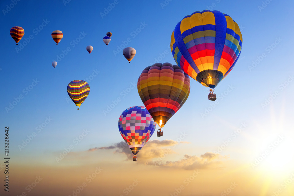 Fototapeta premium Hot air balloons on the air with sunset sky
