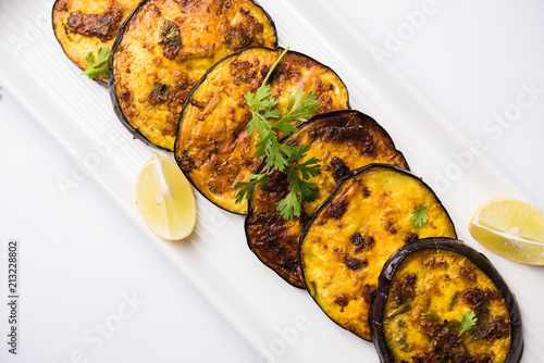 Pan fry crispy baigan / eggplant / brinjal recipe from India. selective focus
 photo