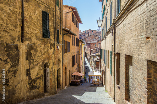Street in old mediaeval town in Tuscany, Siena