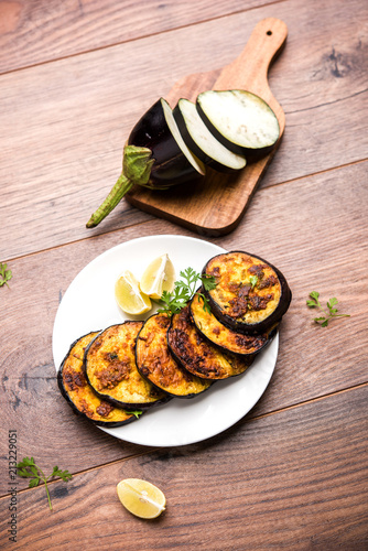 Pan fry crispy baigan / eggplant / brinjal recipe from India. selective focus
