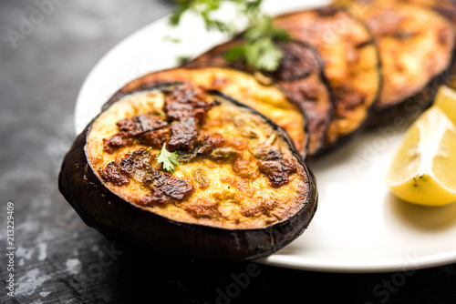 Pan fry crispy baigan / eggplant / brinjal recipe from India. selective focus
 photo