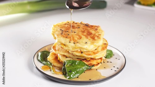 Hot pancakes make butter melt. Maple syrup is flowing down the stack. Mouth-watering still-life of American morning meal photo