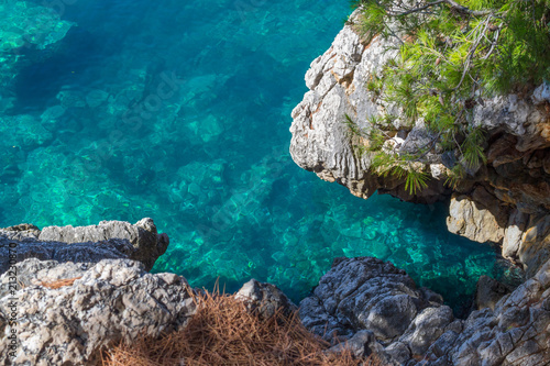 The sea view. Beautiful view from the mountain to the calm Adriatic sea. Blue clear water and large stones.