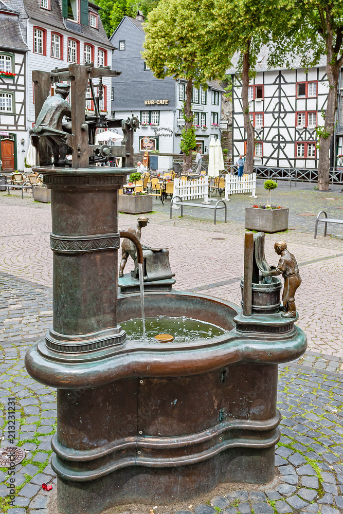 Beautiful fountain in the town square of Monschau, Germany Beautiful fountain in the town square of Monschau, Germany