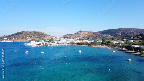 Aerial drone bird's eye view photo of picturesque fishing village of Polonia with traditional fishing boars docked next to island of Kimolos, Milos island, Cyclades, Greece