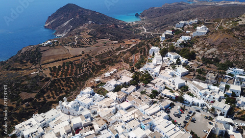 Aerial drone bird's eye view photo of picturesque peak in chora and castle of Milos island overlooking endless blue of the Aegean sea, Cyclades, Greece