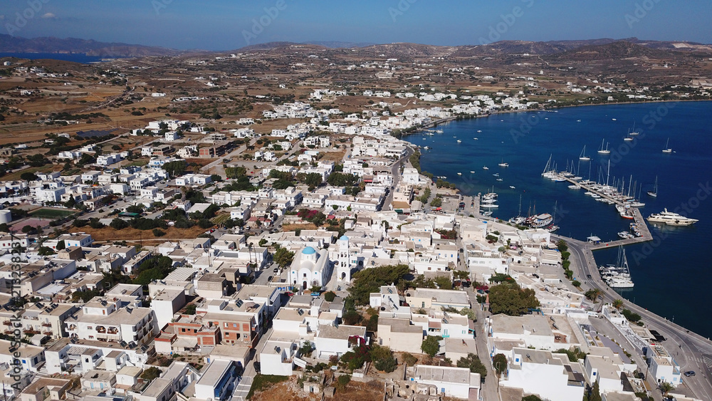 Aerial drone bird's eye view of famous port of Adamantas, Milos island, Cyclades, Greece