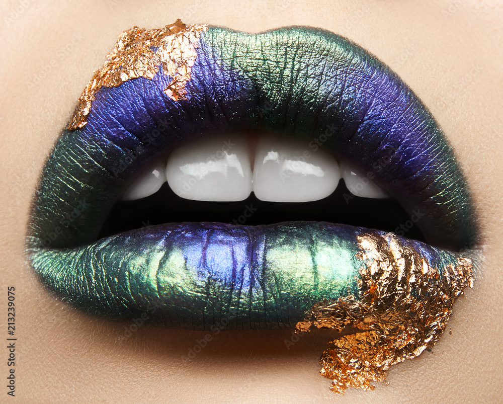 Naklejka premium Macro and close-up creative make-up theme: beautiful female lips with pink lipstick, white diamonds and teeth, retouched photo