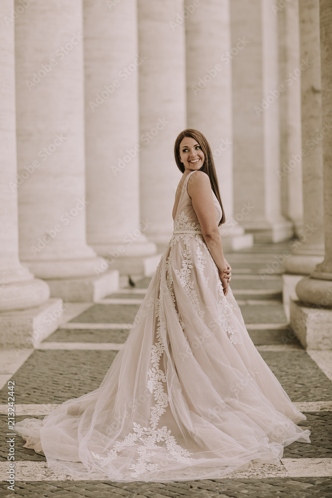 Pretty young bride in wedding dress in the Vatican