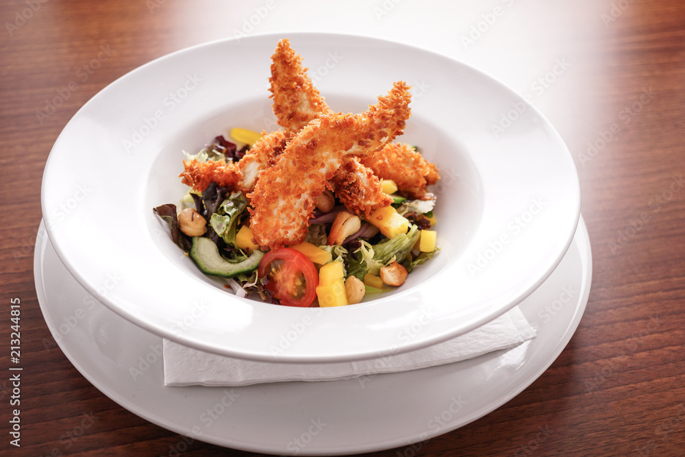Deep Fried Chicken Goujons Served with a Medley Of Mediterranean Vegetables. Deep Fried Chicken Goujons Served with a Medley Of Mediterranean Vegetables.