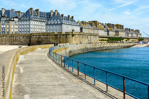 The walled city of Saint-Malo, France, with granite residential buildings sticking out of the rampart.