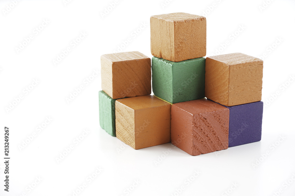 Obraz premium Wooden cube blocks over white background