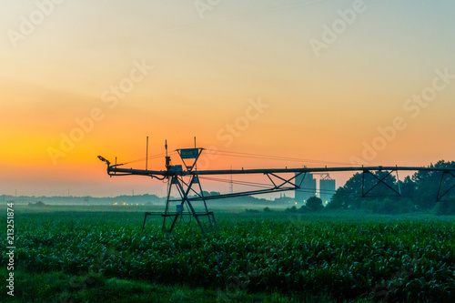 Canvastavla A center pivot irrigation system taken at sunrinse on a farm in rural delaware