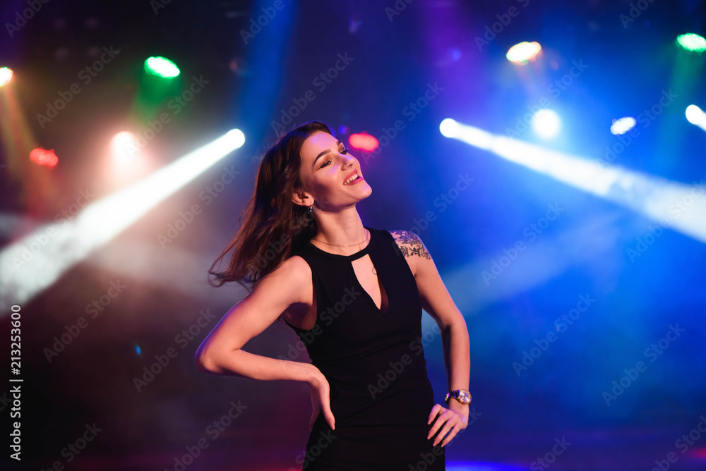 Portrait of dancing girl on disco party
