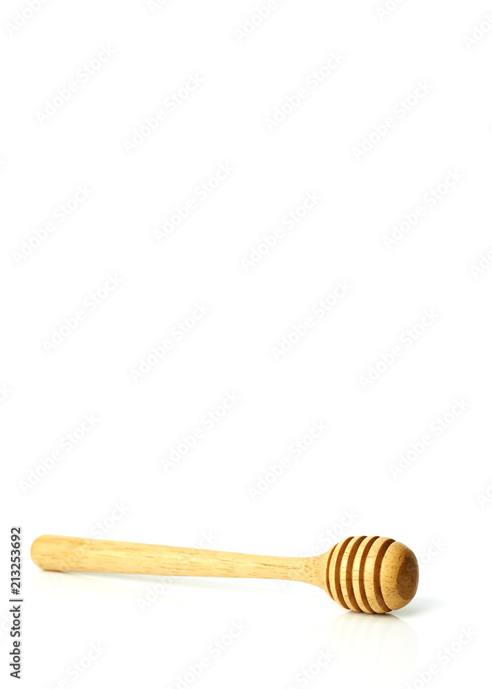 Honey dripping from a wooden honey dipper Honey dripping from a wooden honey dipper