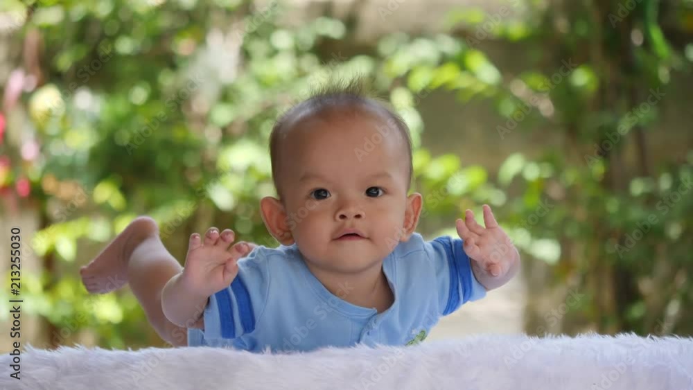 Slow motion Baby laying on bed and laughing happy time Slow motion Baby laying on bed and laughing happy time