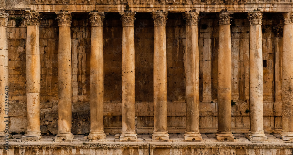 Frontal view of a colonnade - Row of columns of an ancient Roman temple ruin (Bacchus temple in Baalbek)