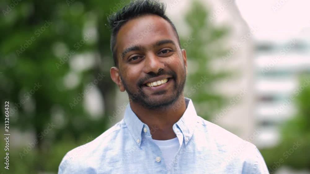 race, ethnicity and people concept - portrait of happy smiling indian man outdoors race, ethnicity and people concept - portrait of happy smiling indian man outdoors