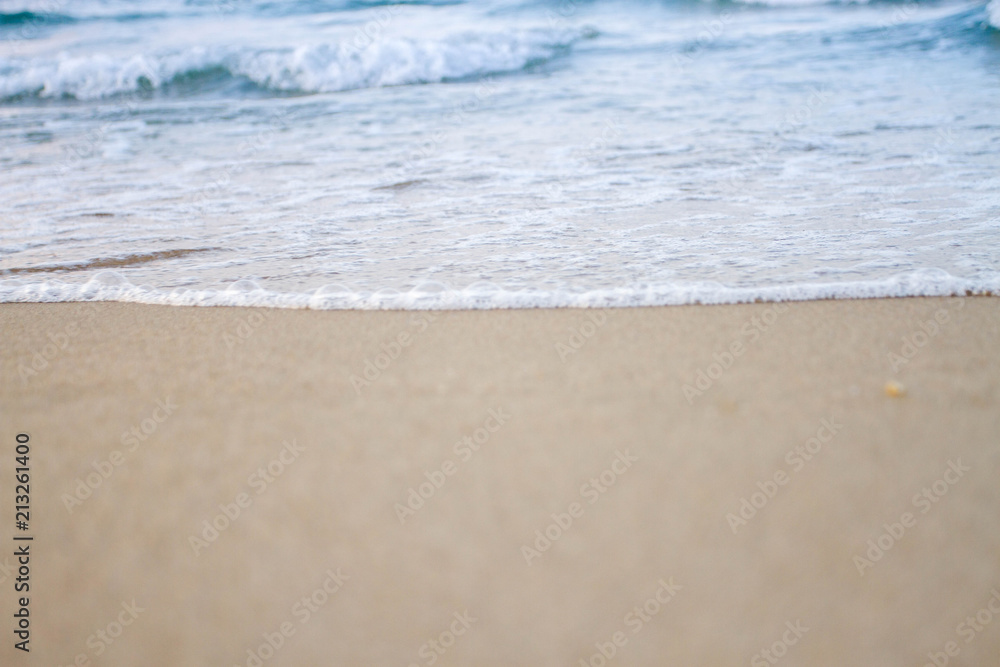 The sea waves on the beach in the morning, the sun is not soft focus The sea waves on the beach in the morning, the sun is not soft focus