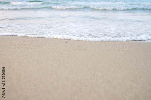 The sea waves on the beach in the morning, the sun is not soft focus
