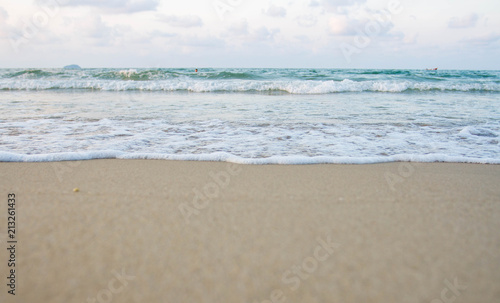 The sea waves on the beach in the morning, the sun is not soft focus