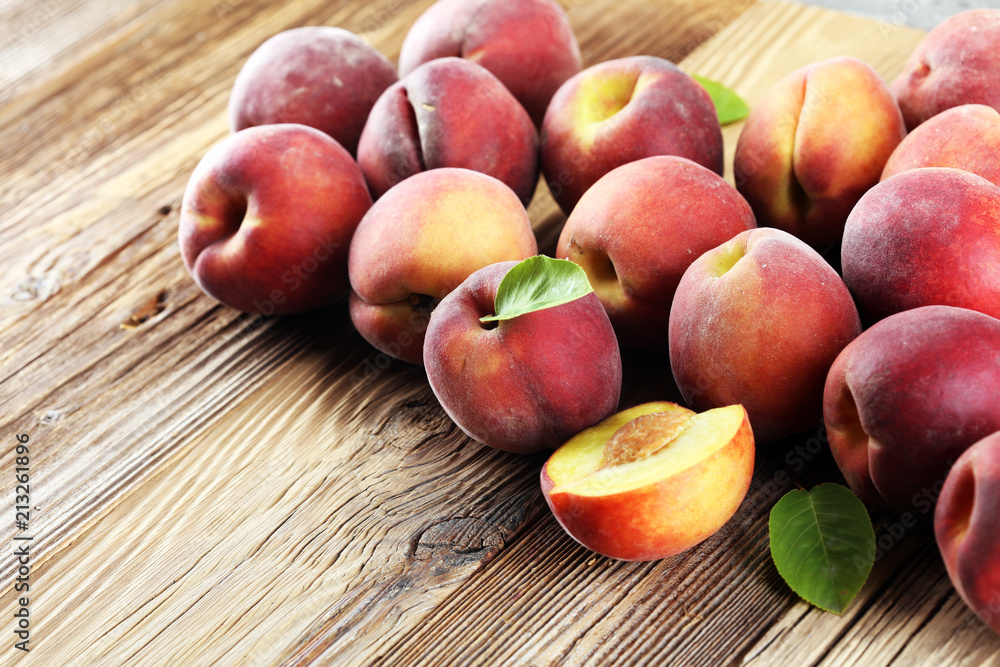 A group of ripe peaches on table A group of ripe peaches on table