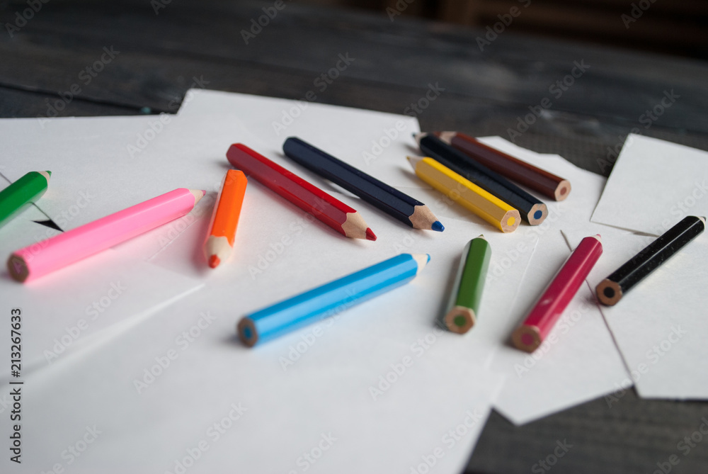 Pile of empty paper cards and color pencils Pile of empty paper cards and color pencils